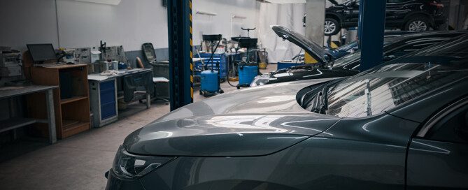 An empty auto dealer service bay area illustrates the serious technician shortage.